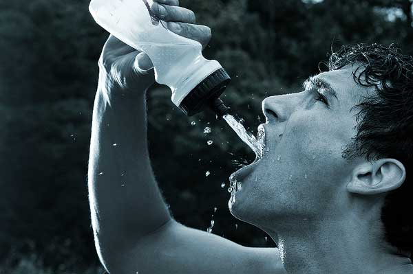 Runner Drinking from Water Bottle