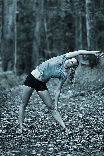 Stretching Before a Run in the Woods